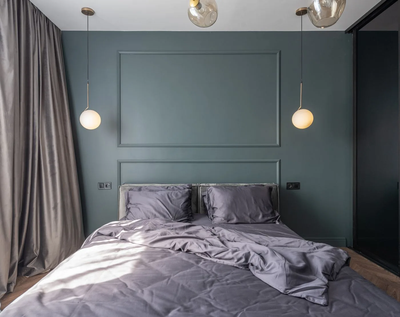A softly layered bedroom with daylight through curtains